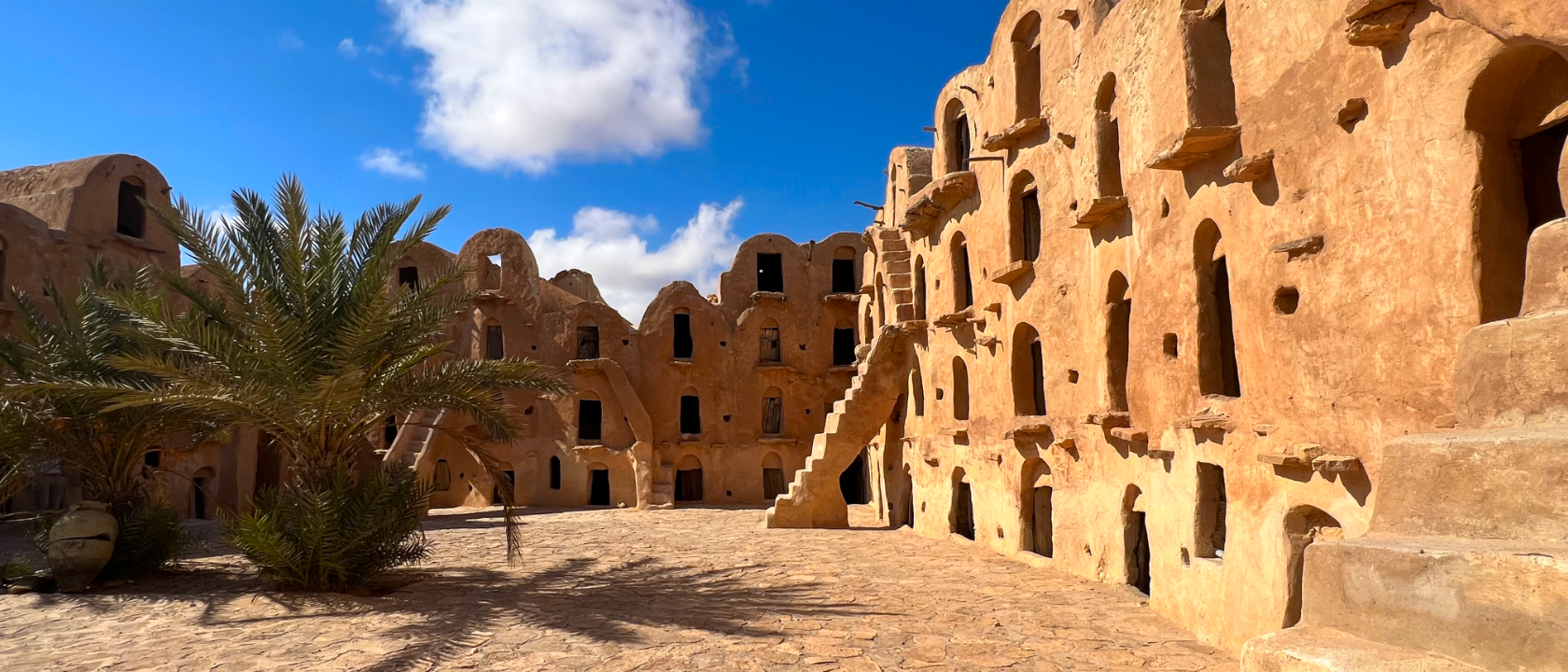 Ksar Ouled Soltane, Southern Tunisia. Originally built in the 15th century, the mud-brick ksar is spread over two courtyards connected by a passage made of palm wood. The ghorfas, which are four stories high, were used to store grain on the lower levels and olives on the upper levels.